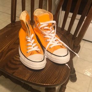 Yellow converse high top sneakers